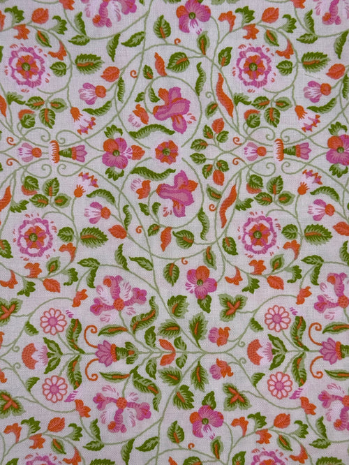 Floral patterned fabric with pink, green, and orange flowers on a white background
