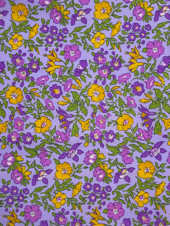 Floral pattern with purple and yellow flowers on a purple background