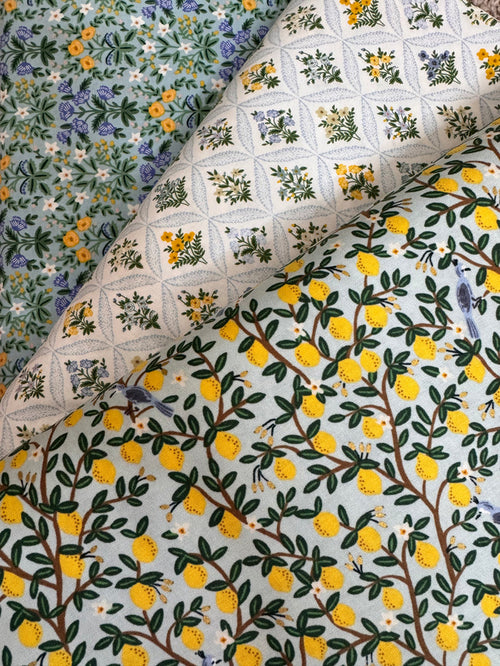 Three different floral patterns on fabric swatches.