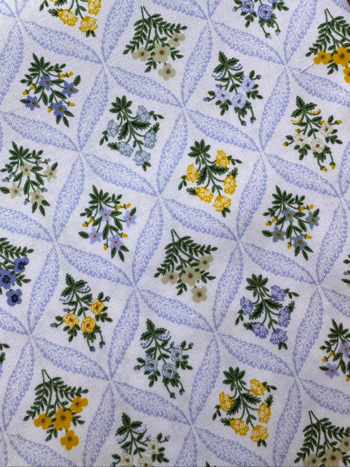 Floral patterned fabric on a wooden surface