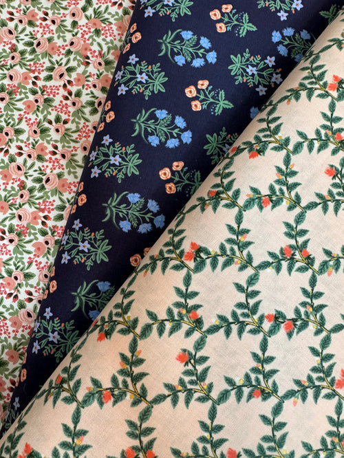 Three different floral patterned fabrics arranged together.
