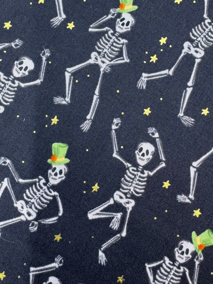 Fabric with skeleton pattern on a wooden surface