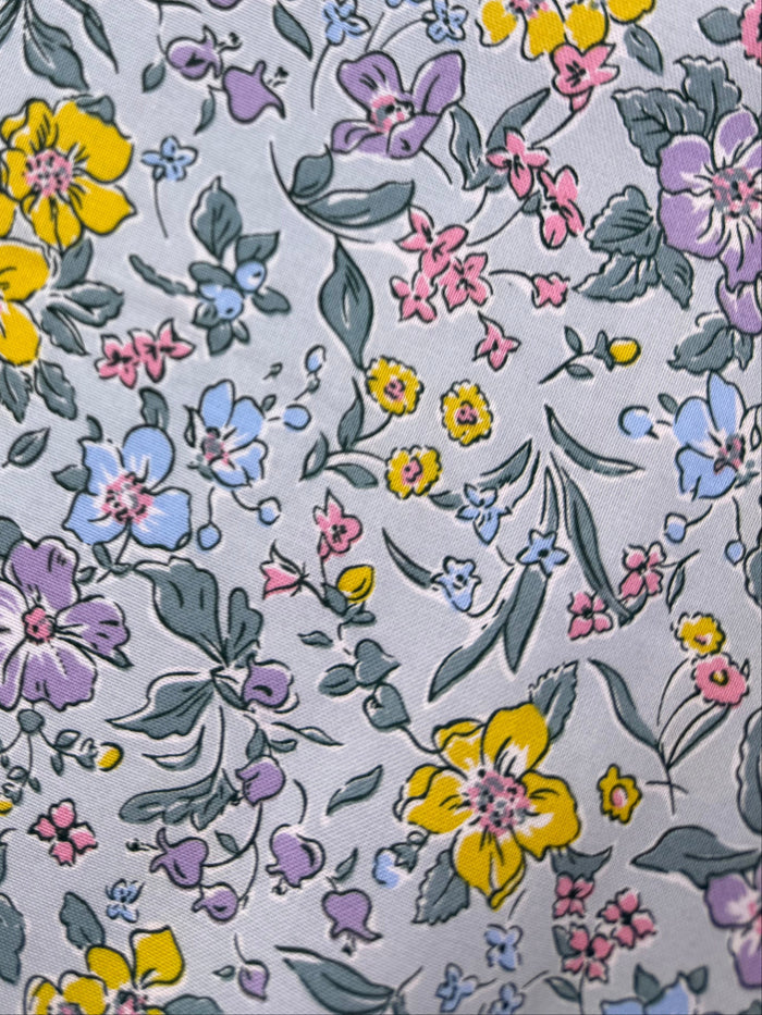 Floral-patterned fabric on a wooden surface